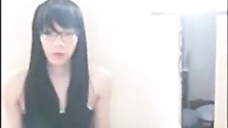 Cute Asian crossdresser cums on rubber cock